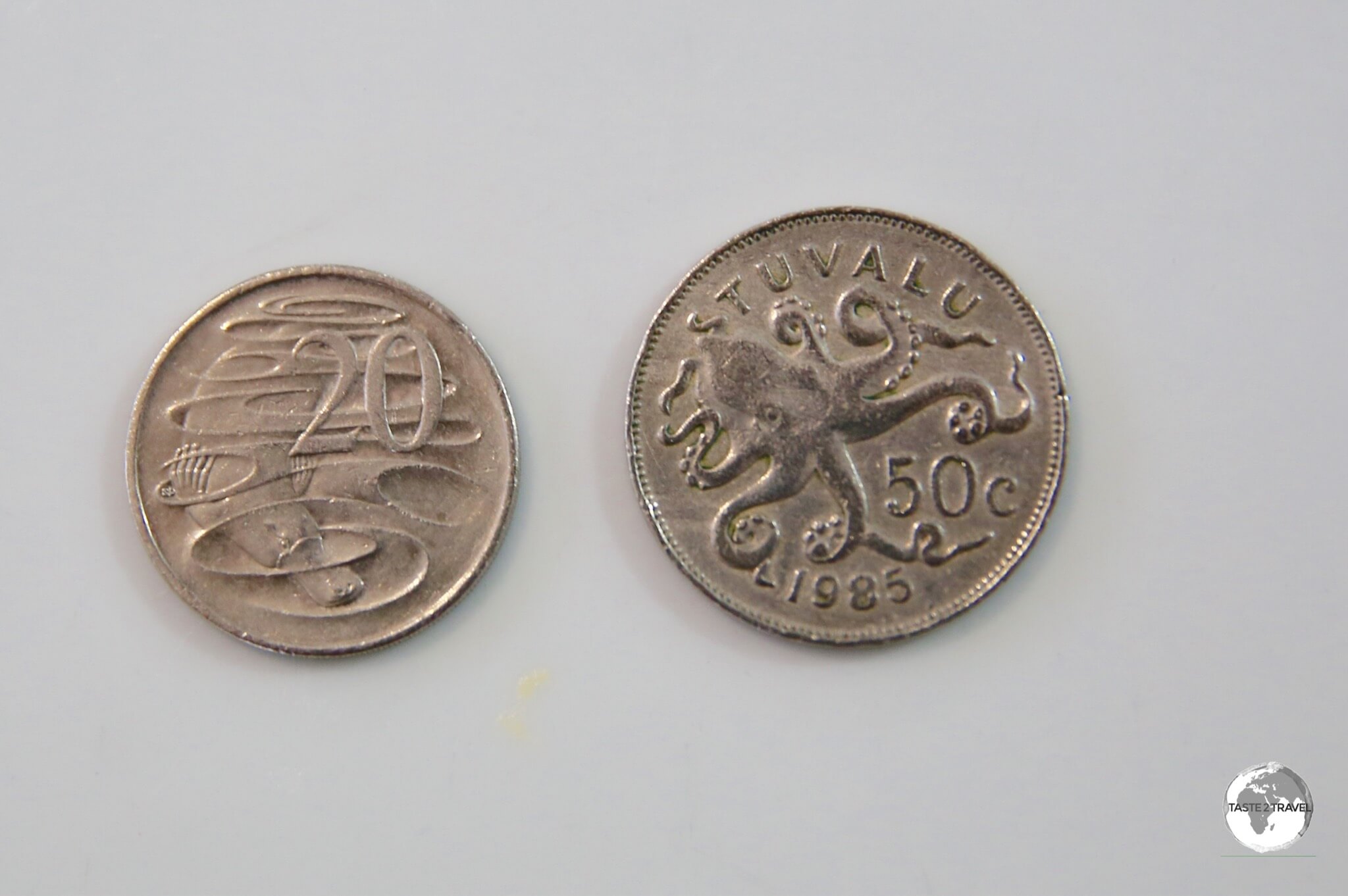 The Tuvalu 50 cent and Australian 20 cent coins are obviously different sizes in this enlarged photo but when held in your hand they are very similar.