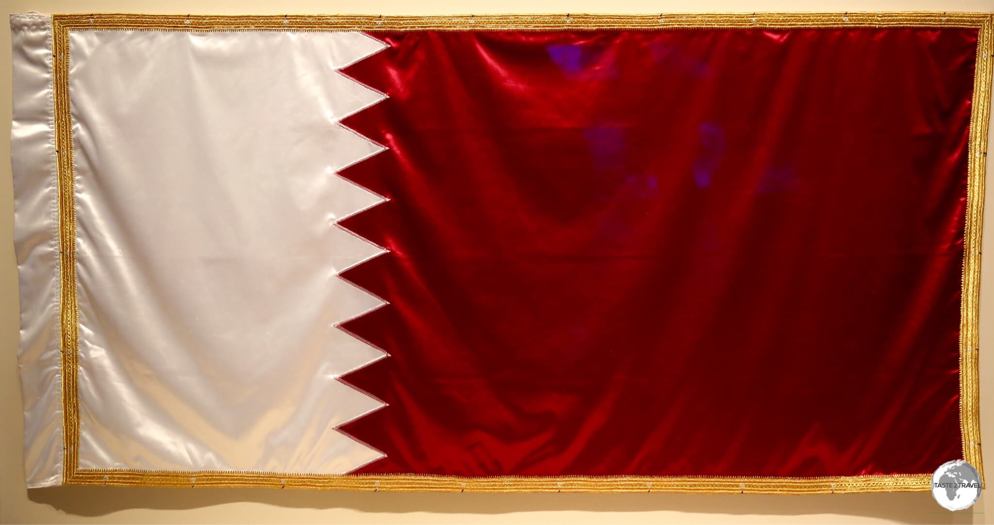 The Qatar flag displayed in the National Museum of Qatar.