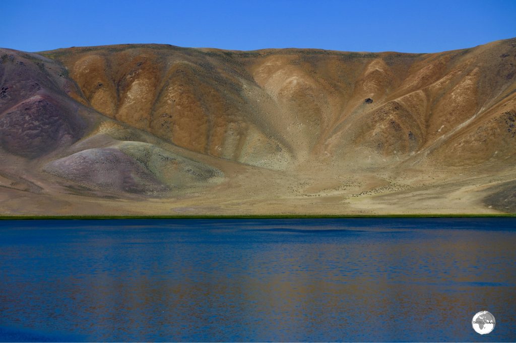 Different minerals provide a colourful backdrop to Bulunkul lake.
