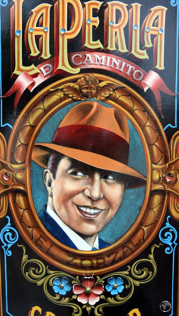 A portrait of Carlos Gardel in the 'La Perla de Caminito' bar, a highlight of the La Boca entertainment neighbourhood of Buenos Aires.