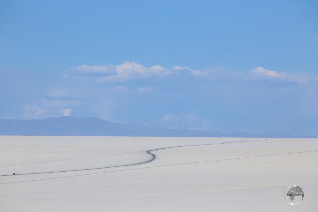 What looks like a tarmac road is actually a track across the Salar de Uyuni, which has been blackened by many rubber tyres.
