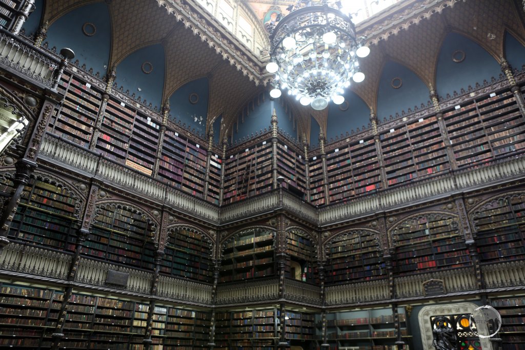 The stunning book collection, arranged on three levels of bookshelves at the Royal Portuguese Cabinet of Reading in Rio de Janeiro, is an incredible sight.