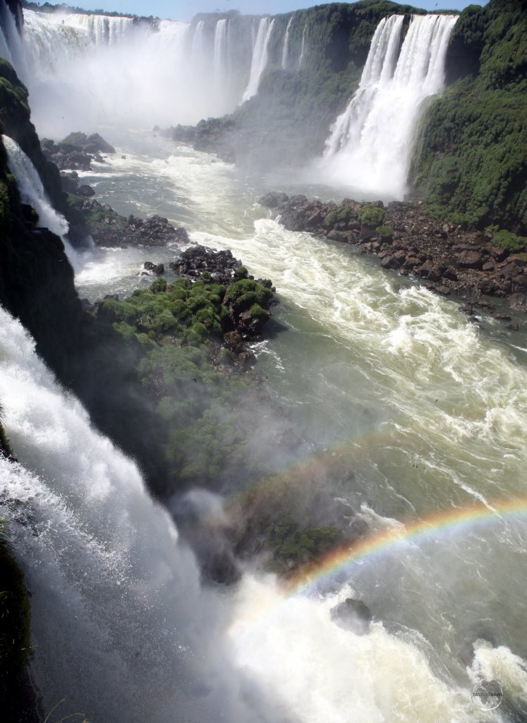 Of the 275 distinct waterfalls which comprise Iguaçu Falls, the Devil’s Throat (background) is the main, thundering attraction.