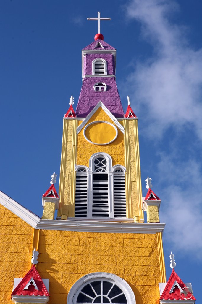 The roof and exterior walls of the 'Iglesia de San Francisco', in Castro, Chiloé Island, are lined with sheets of brightly painted galvanized iron.