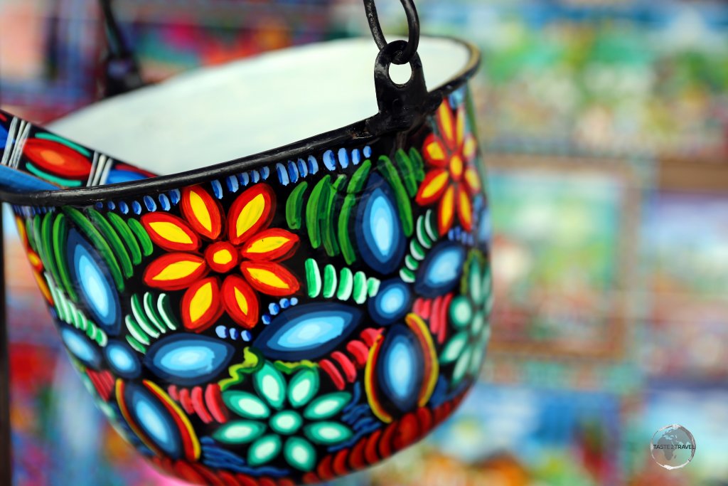 Colourful, hand-painted kitchenware at the Otavalo craft market.