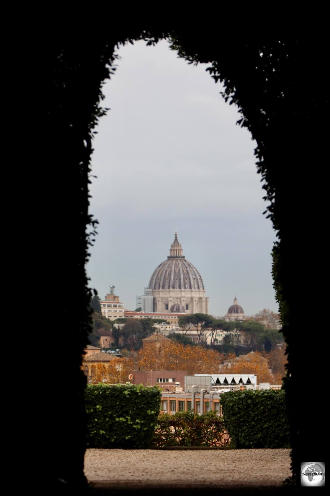 The view of the dome of St. Peter's Basilica through the famous 'Keyhole of Malta'. 