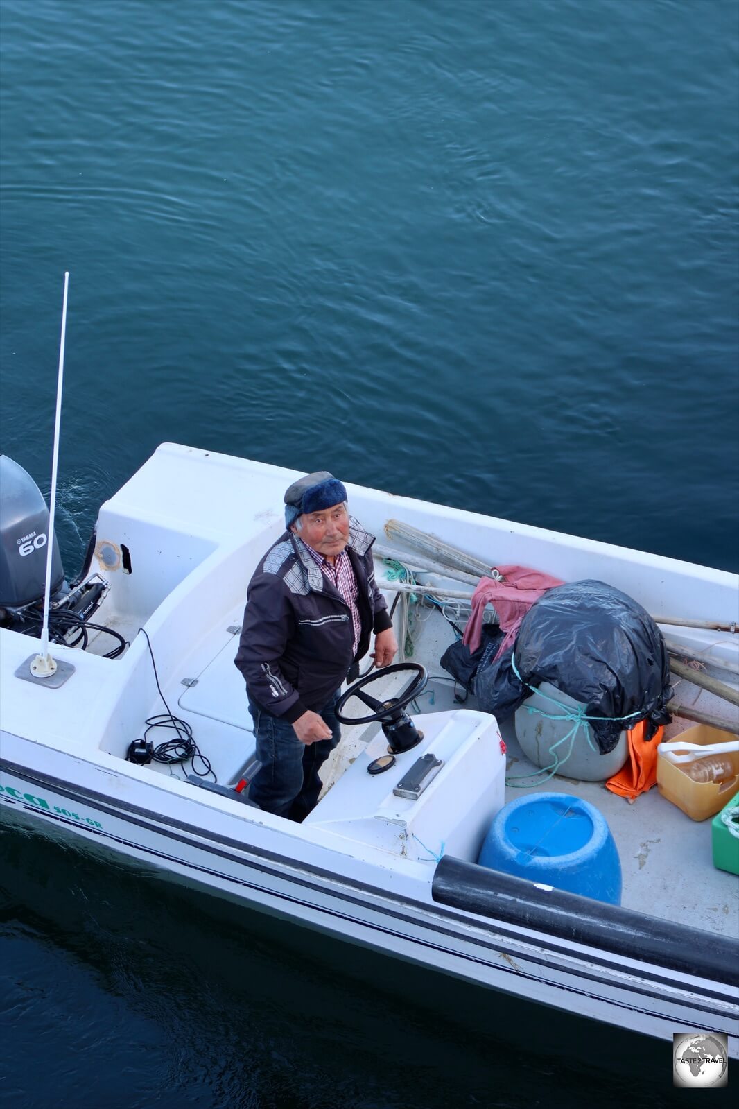 A local from Kangaamiut travelled out in his boat to greet the Sarfaq Ittuk.