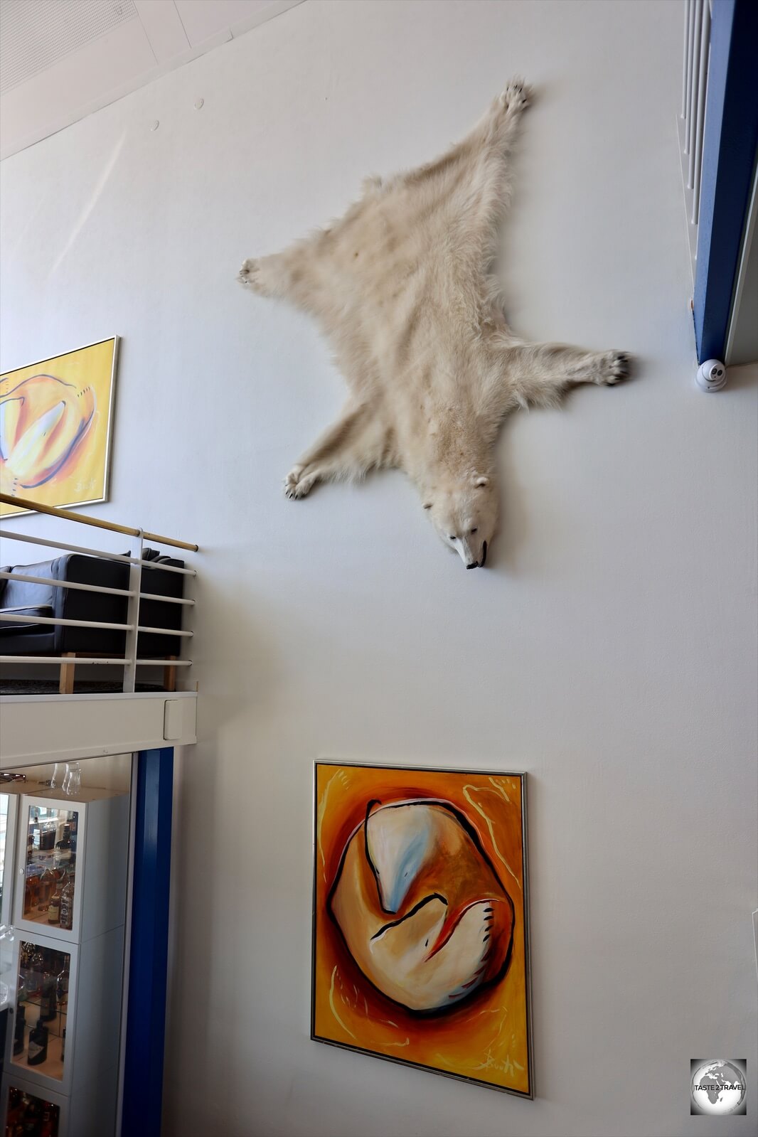 A polar bear skin and polar bear artwork adorn the walls of the Hotel Qaqortoq. 