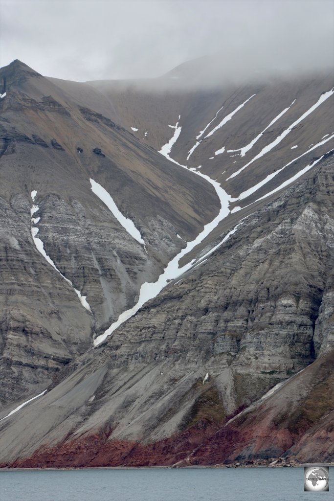 Minerals colour the soil of a mountain slope on the Billefjorden.