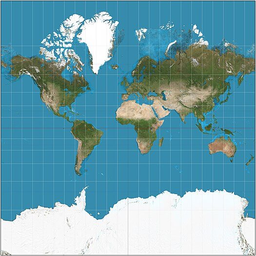 A map of the world using the Mercator Projection - with grid lines showing the inflation of landmasses away from the equator. <br /> <i>Source: Wikipedia.</i>