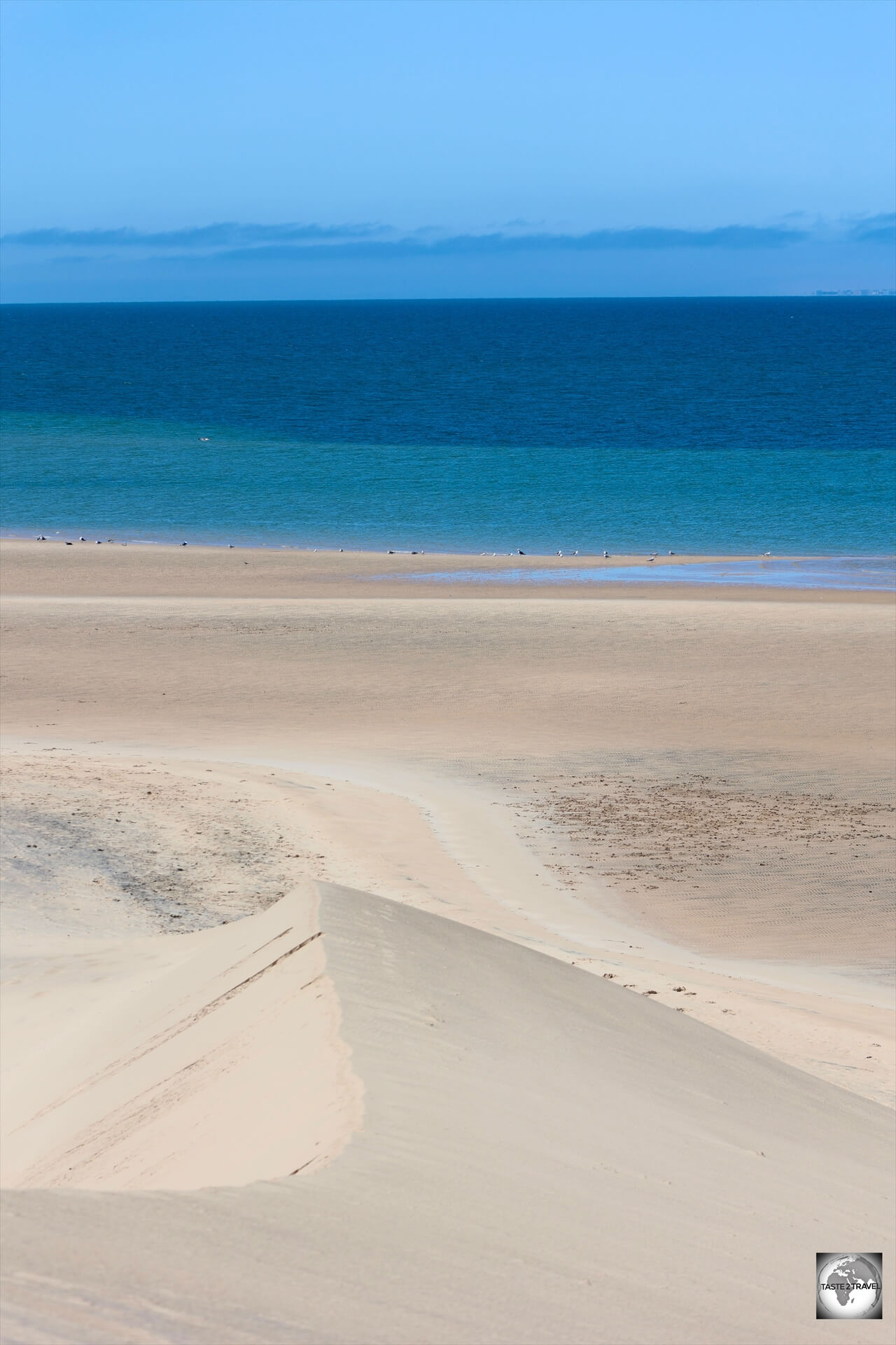 Views of the azure waters of the Atlantic Ocean from the top of the White Dune. 