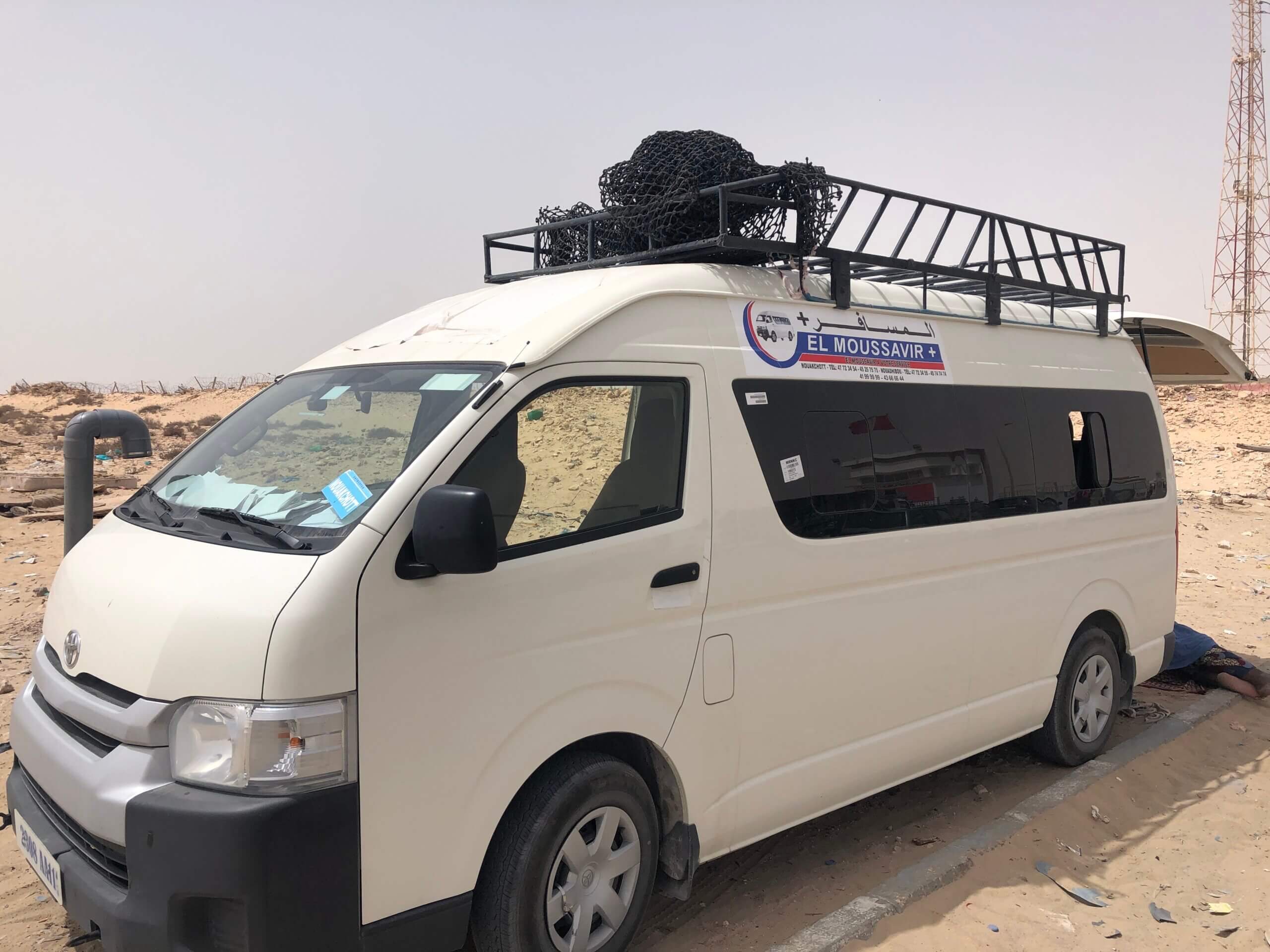 The minibus from El Moussavir Plus company, waiting at the exit of the Moroccan border post. 