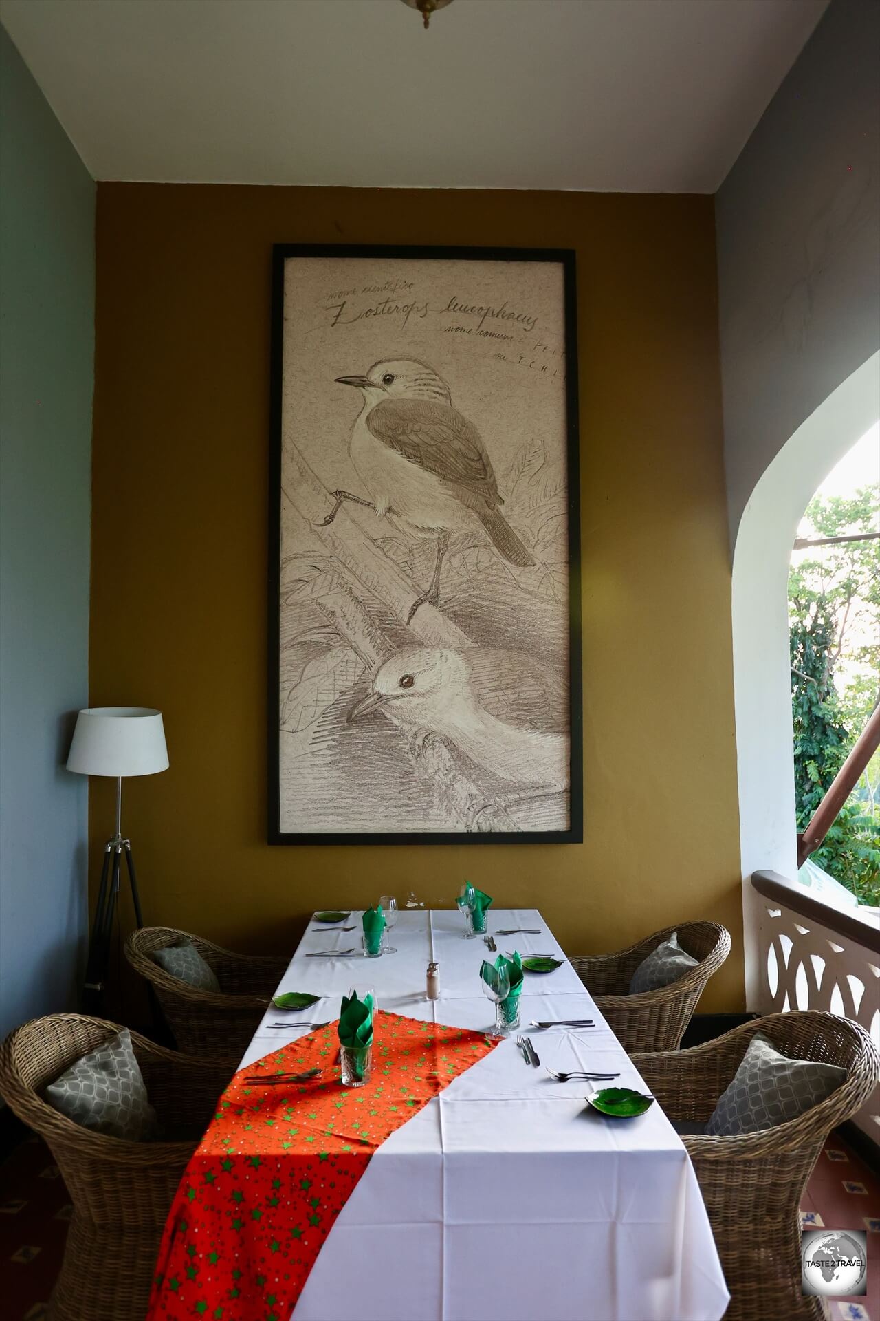 Giant sketches of endemic birds feature on the balcony walls at Hotel Roça Sundy.