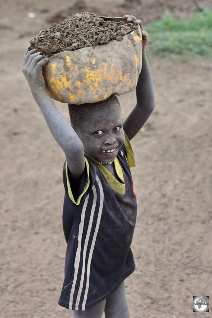 The collecting of cow dung keeps most of the Mundari children busy.