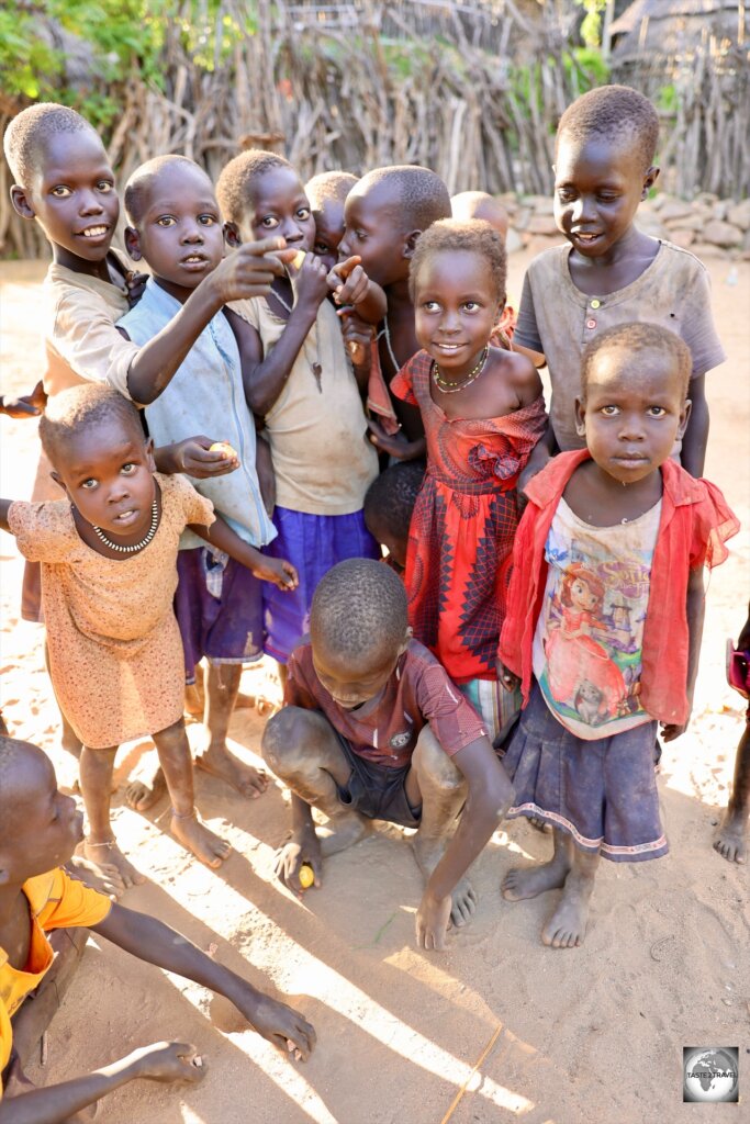 Lotuko children, playing a game at Ilieu village.