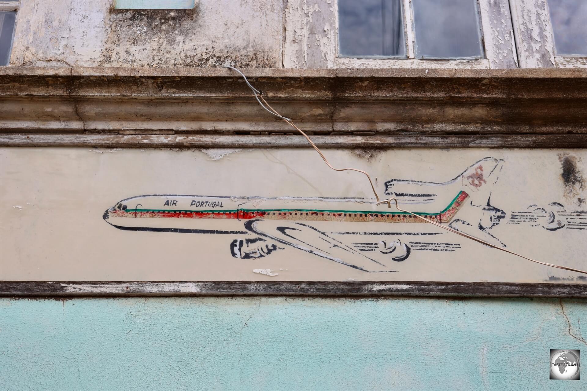 An old TAP Air Portugal advertisement in downtown São Tomé.